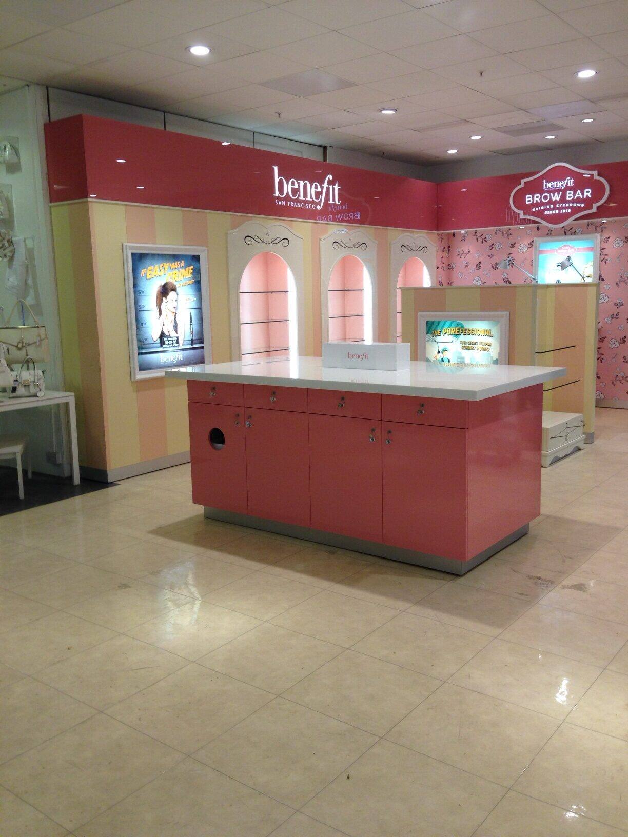 Benefit brow bar and retail counter in pink finish