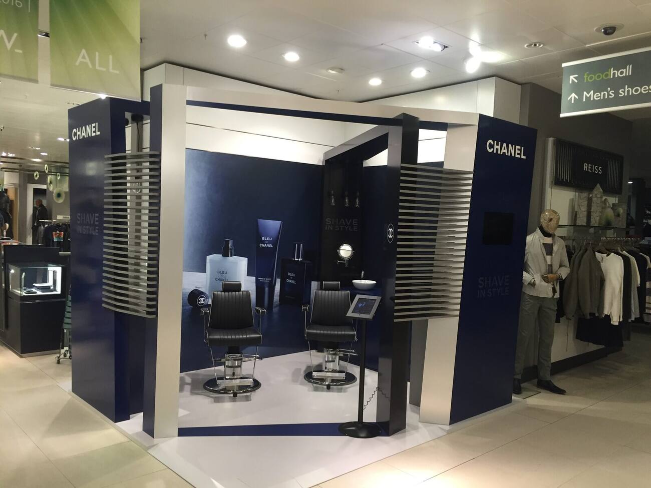 Chanel grooming promotional space with barber chairs