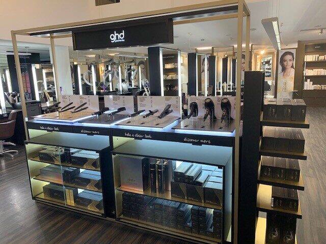 ghd styling and product counter with glass display cases