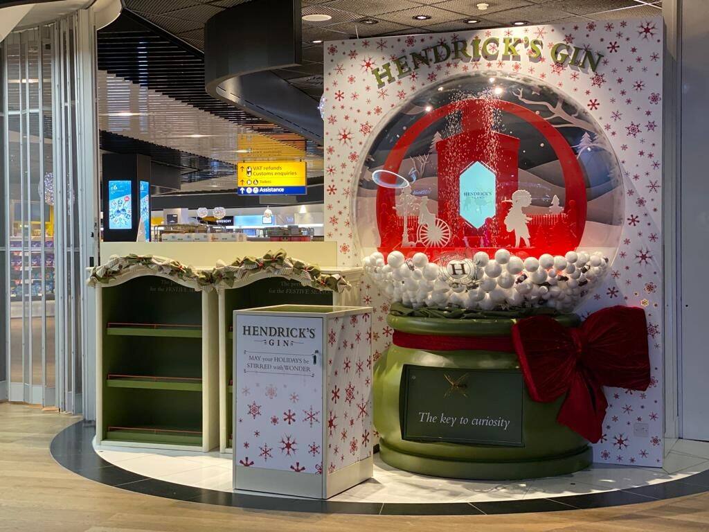 Hendrick's Gin Christmas snow globe display at Heathrow