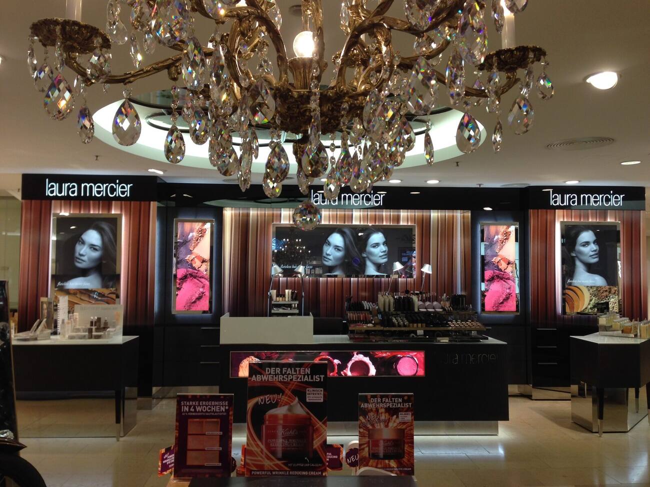 Laura Mercier beauty counter with backlit graphics