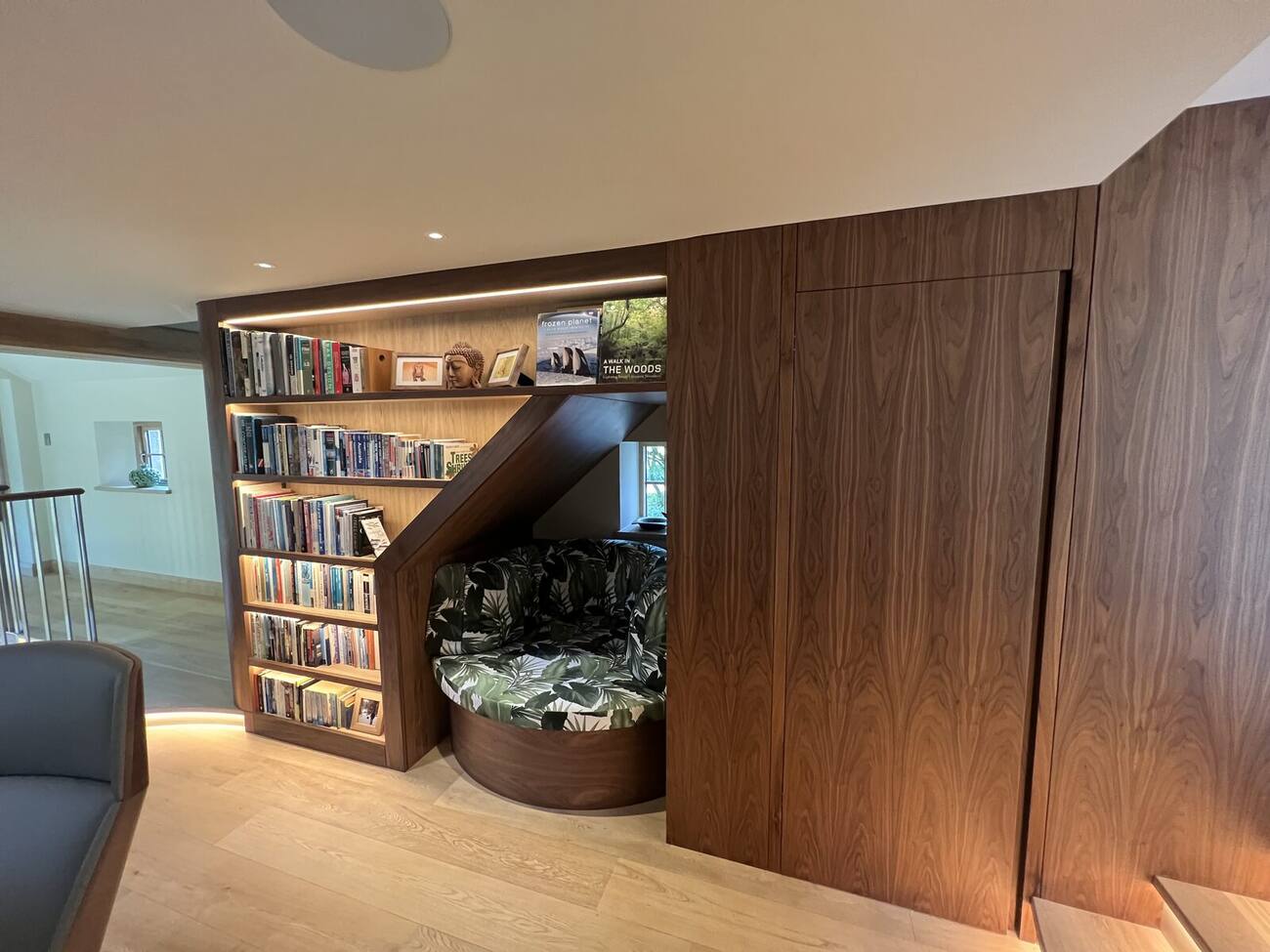 Walnut library bookcase with reading nook in a private home