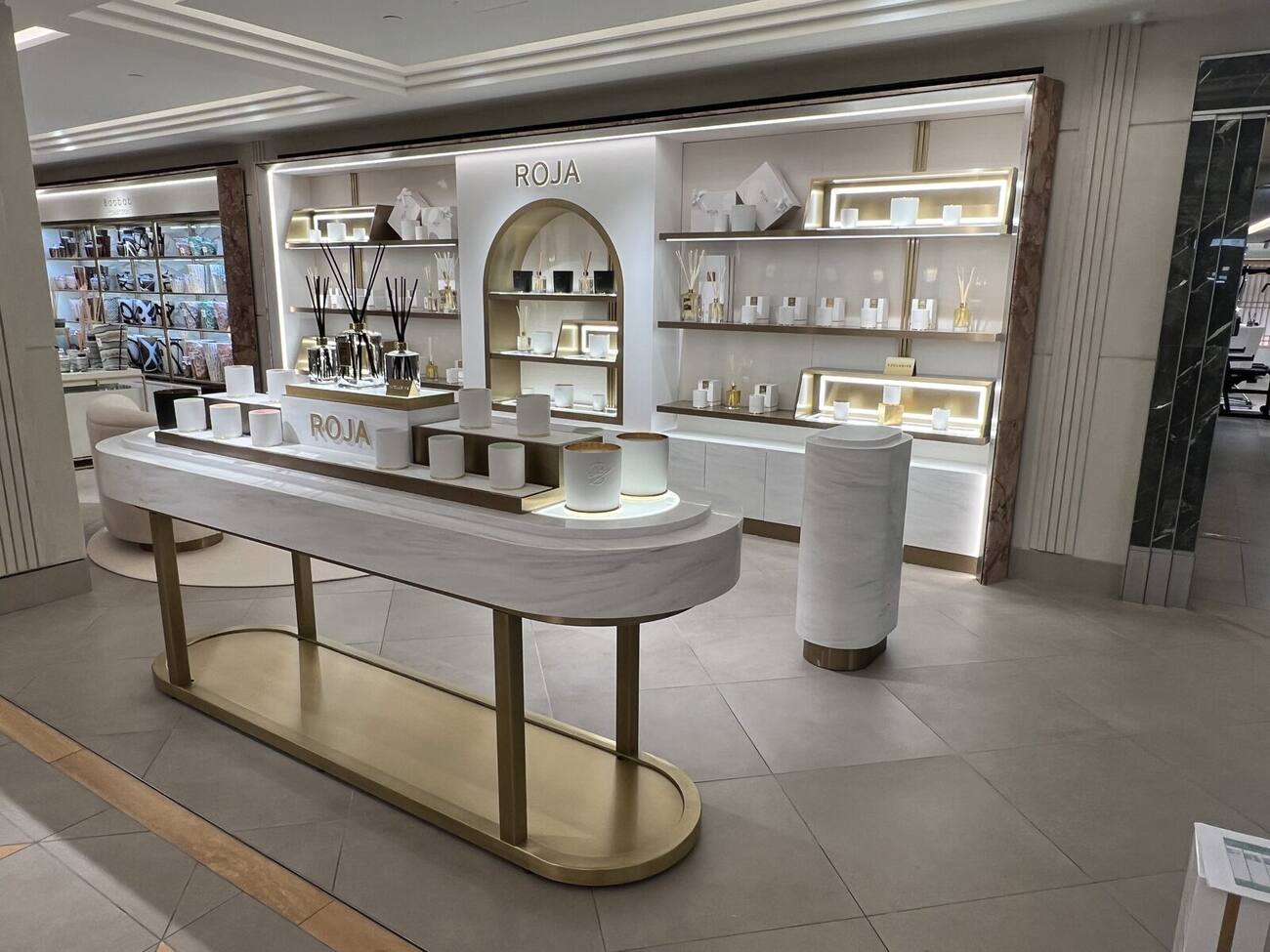 Roja Parfums display area with illuminated arched shelving, Harrods