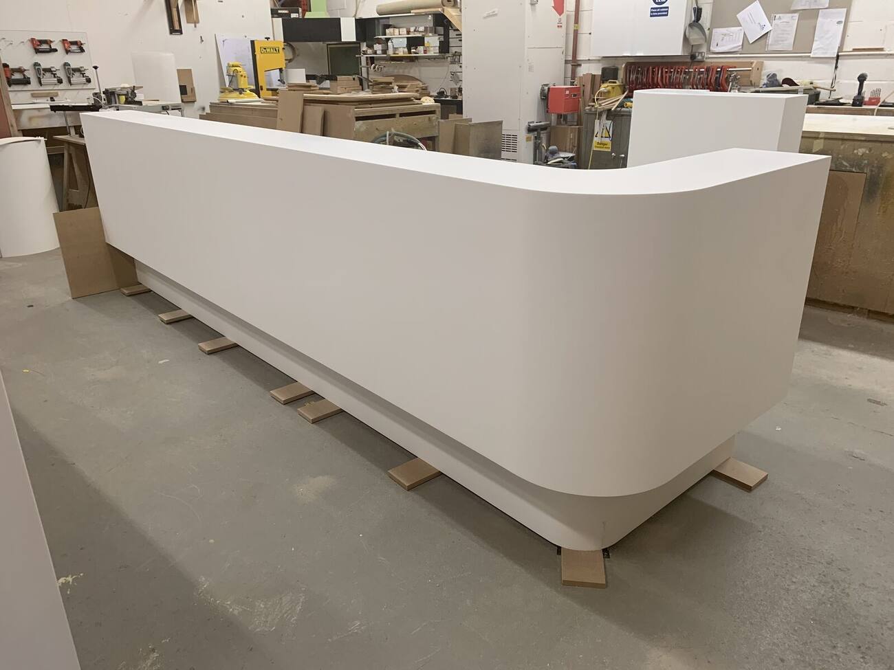 Curved reception counter under construction in the Procraft Design workshop